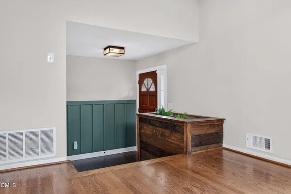 a bed room with a bed and dresser