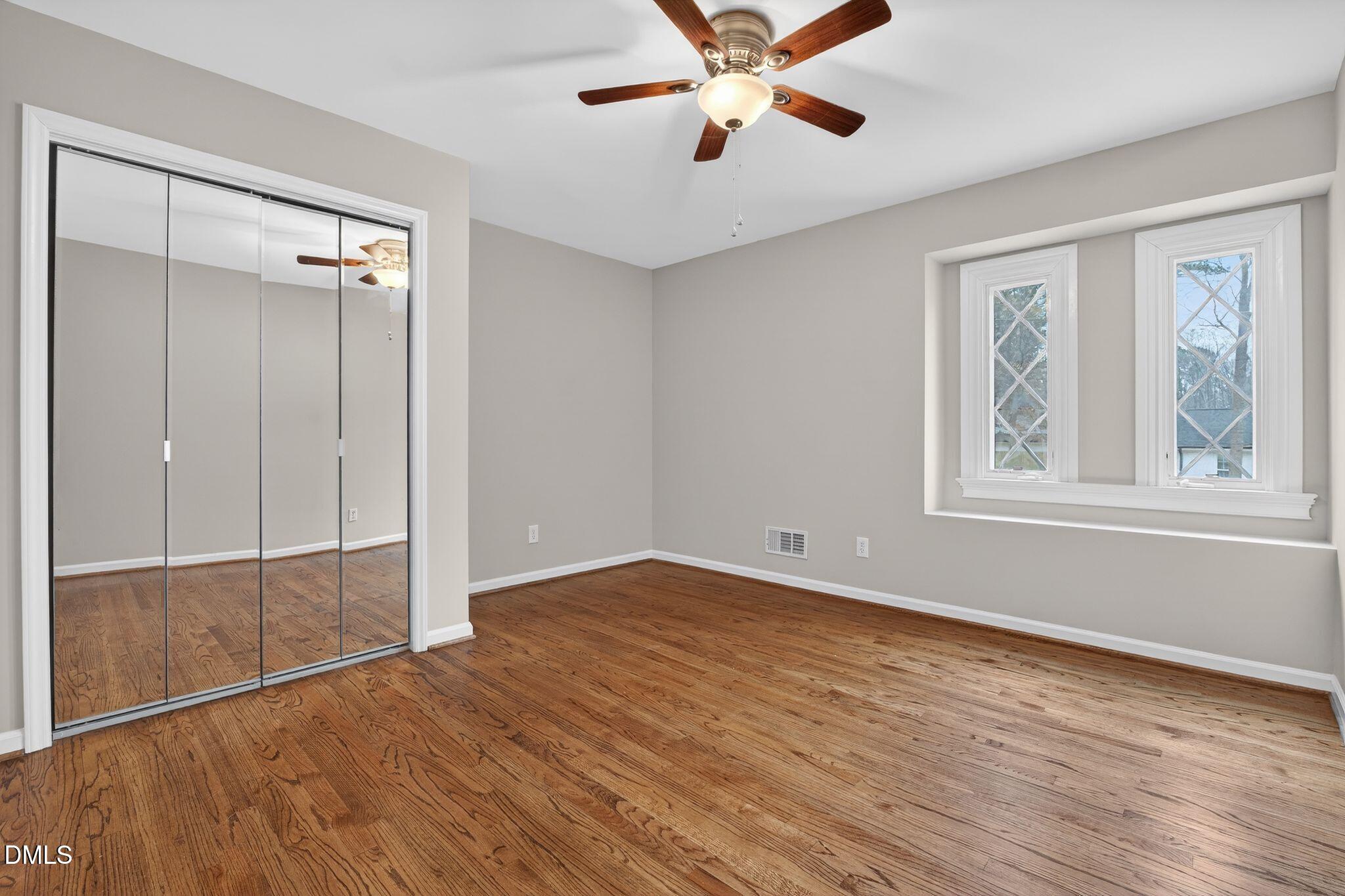 1201 Chardon Court Raleigh, NC 27609 - Photo 15 of 47 wooden floor in an empty room with a window