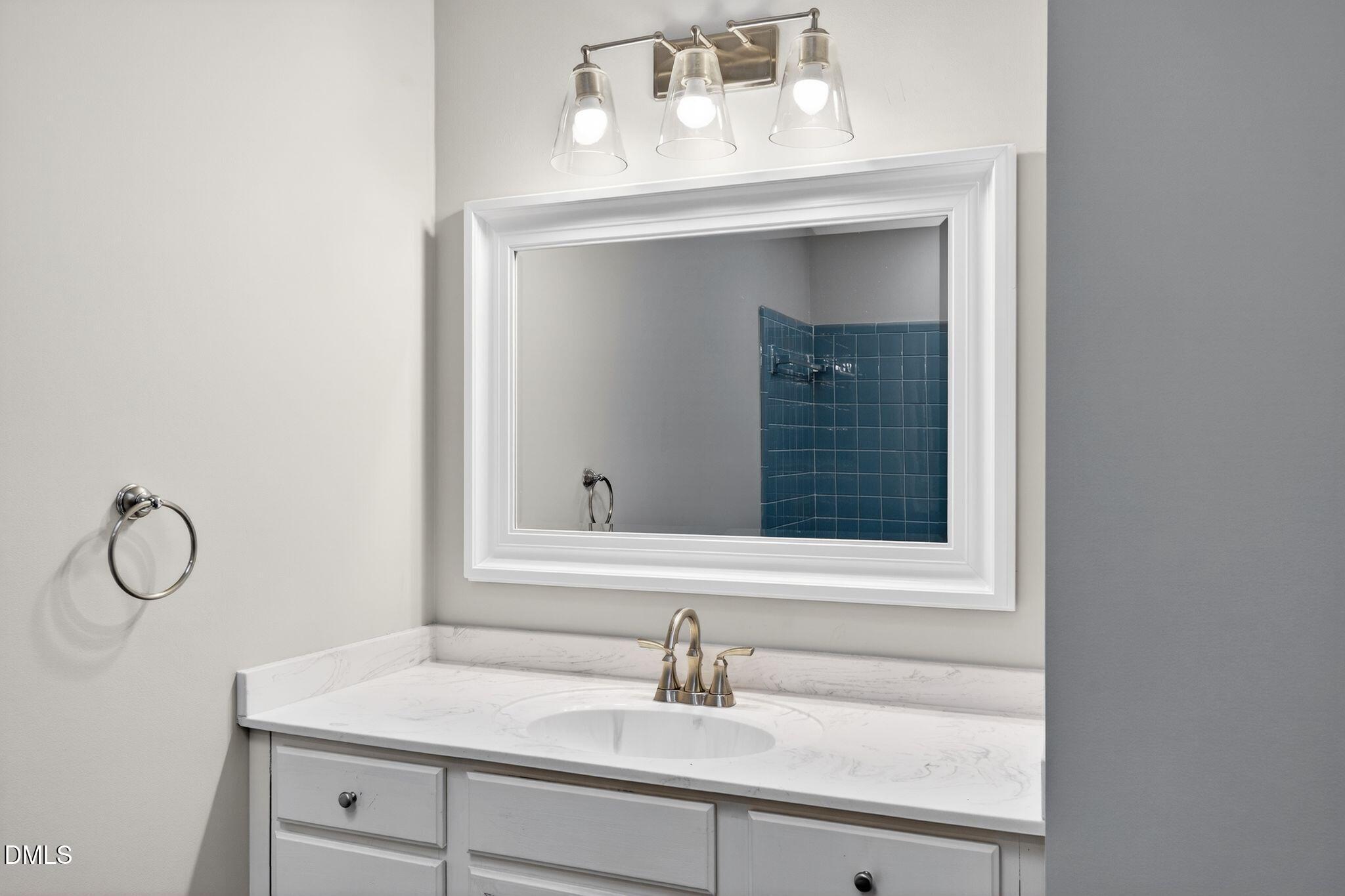 1201 Chardon Court Raleigh, NC 27609 - Photo 24 of 47 a bathroom with a sink and vanity