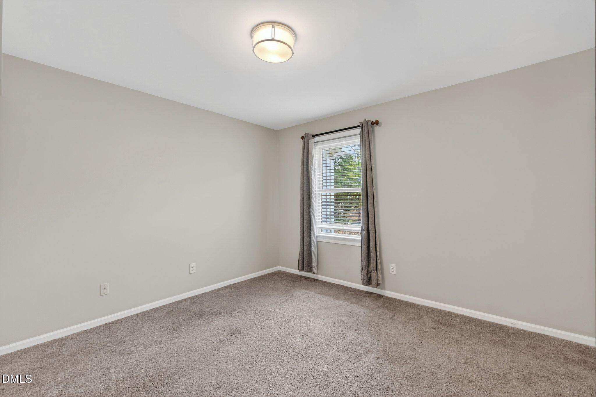 1201 Chardon Court Raleigh, NC 27609 - Photo 25 of 47 an empty room with windows