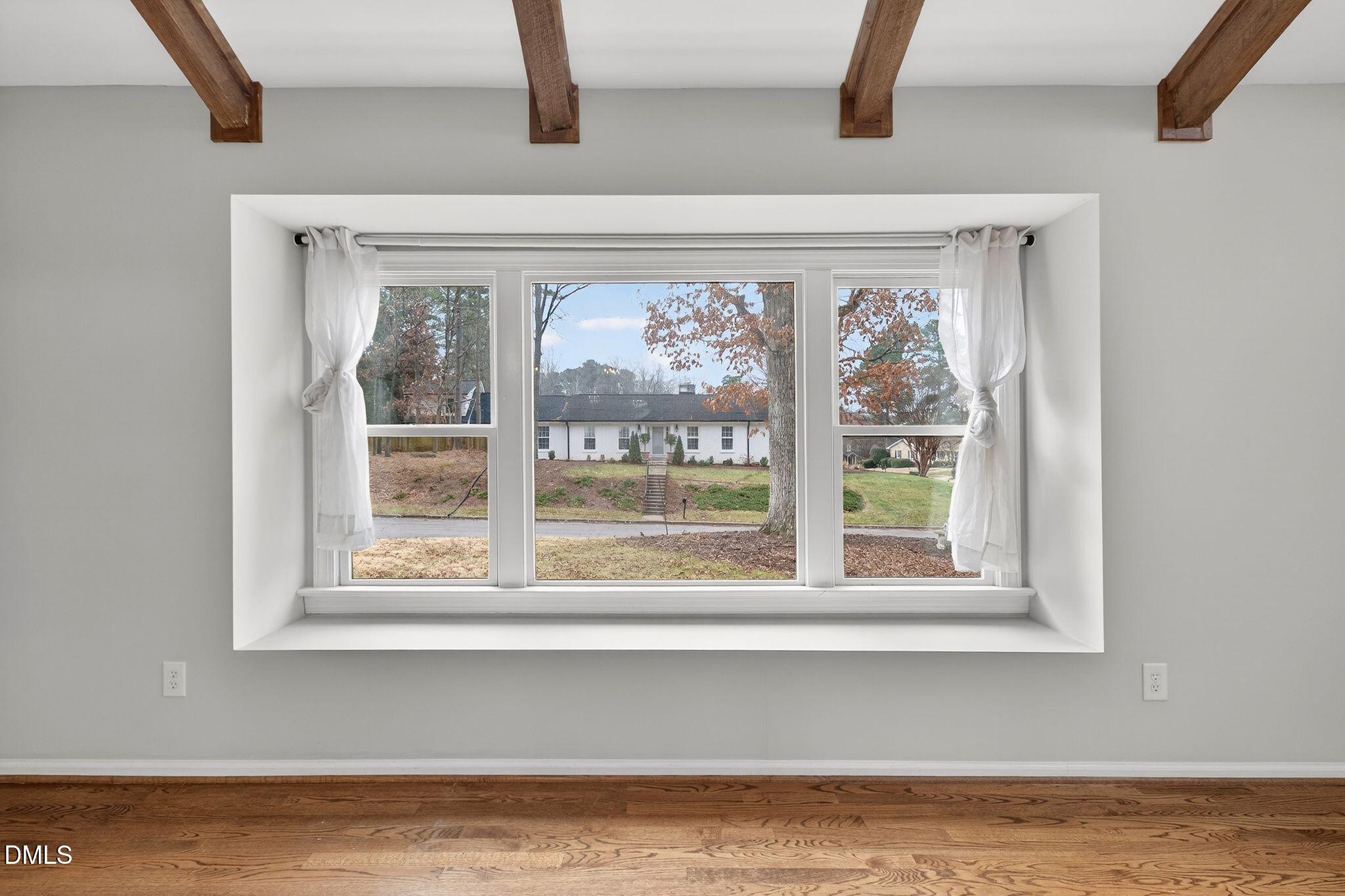 1201 Chardon Court Raleigh, NC 27609 - Photo 3 of 47 a view of a livingroom with wooden floor and a window