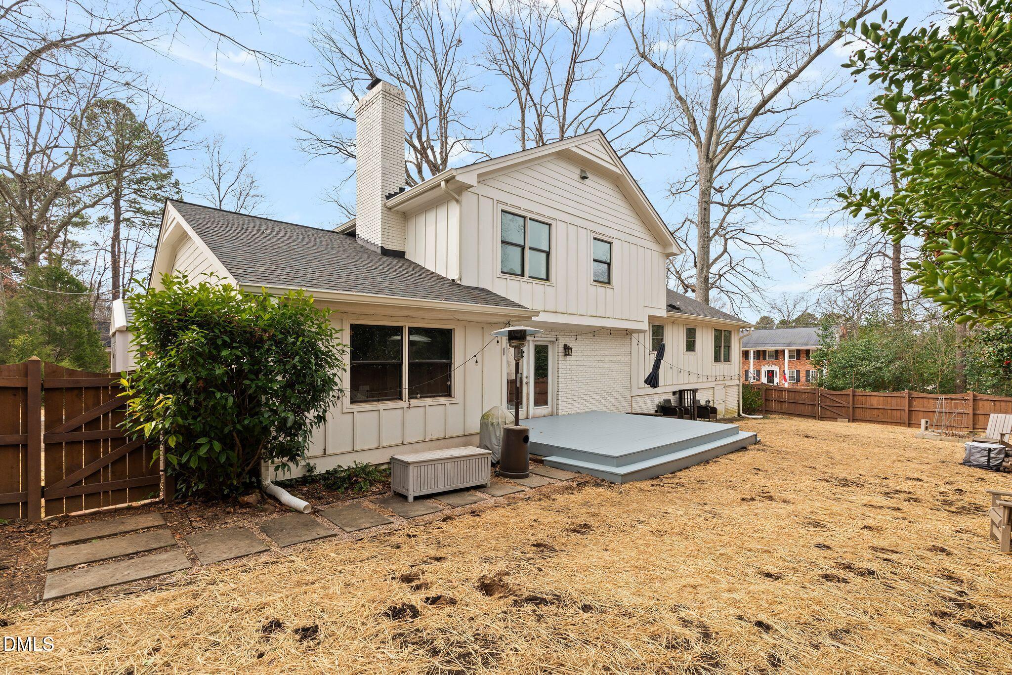 1201 Chardon Court Raleigh, NC 27609 - Photo 33 of 47 a front view of a house with a yard and garage