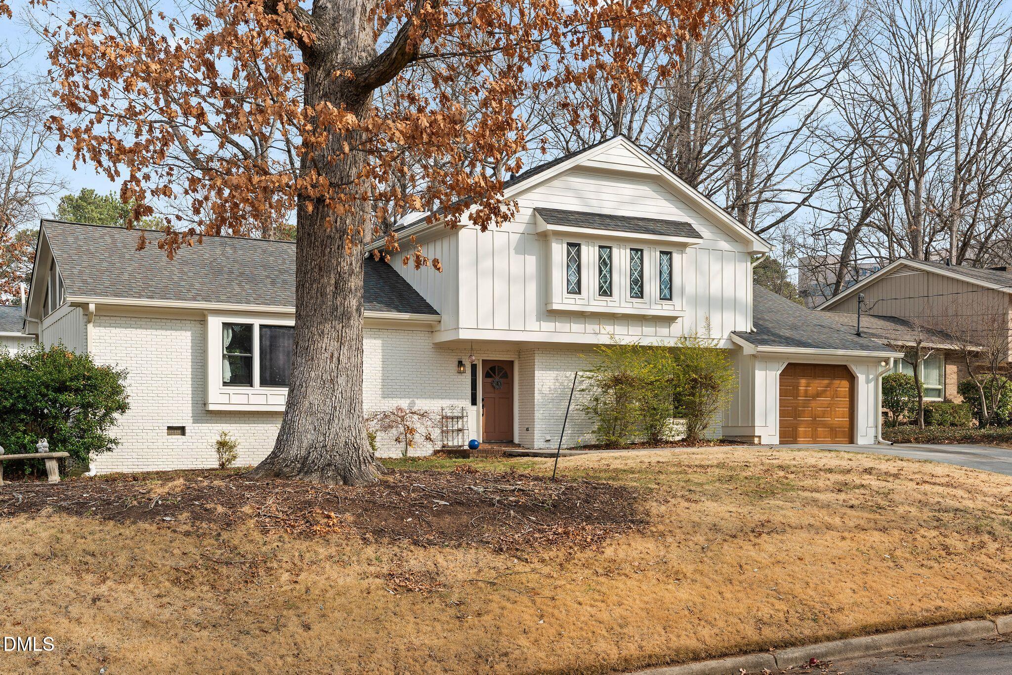 1201 Chardon Court Raleigh, NC 27609 - Photo 43 of 47 a front view of a house with a yard