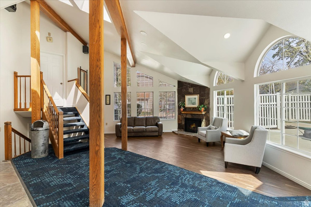 650 South Main Street, Unit 4104 Bountiful, UT 84010 - Photo 19 of 22 Living room featuring lofted ceiling, a stone fireplace, a skylight, recessed lighting, and wood finished floors