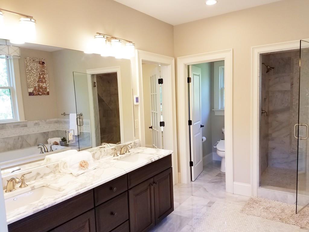 39 Bloomfield Street Lexington, MA 02421 - Photo 23 of 42 a bathroom with a granite countertop sink mirror and double