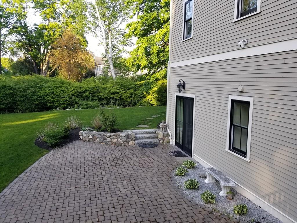 39 Bloomfield Street Lexington, MA 02421 - Photo 42 of 42 a view of a patio with a table and a chairs
