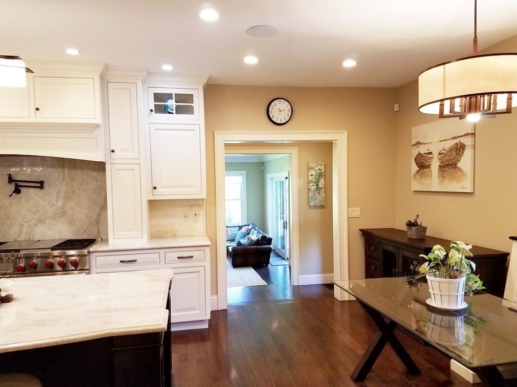 39 Bloomfield Street Lexington, MA 02421 - Photo 5 of 42 a kitchen with a table and chairs in it