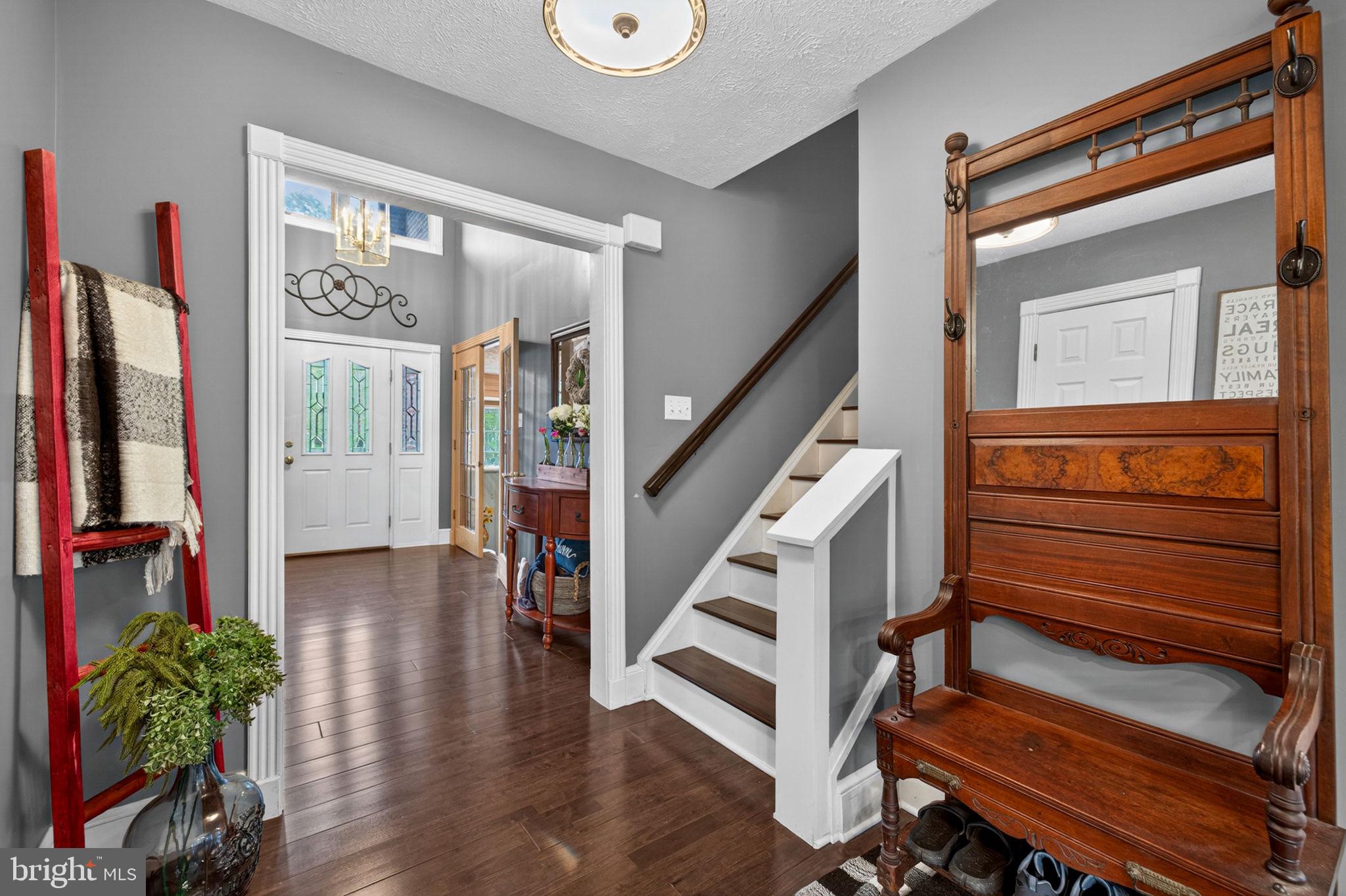 63 Rutherford Circle Sterling, VA 20165 - Photo 14 of 52 Stairway to upper level is in the Foyer hallway