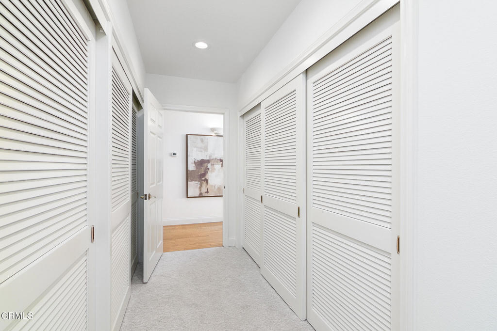 101 Rios Court Solana Beach, CA 92075 - Photo 33 of 67 a view of a hallway with white cabinets