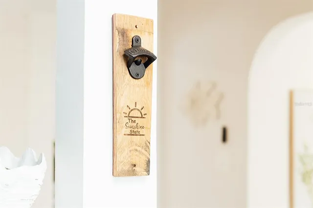 a bedroom with a bed and painting on the wall