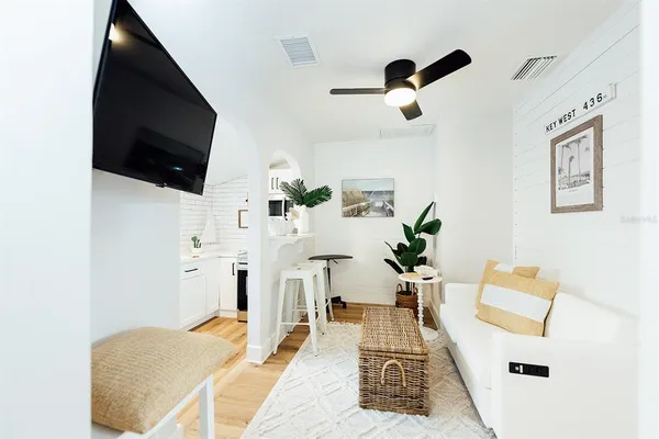 a living room with furniture and a flat screen tv