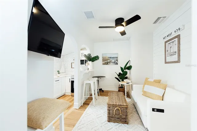 a living room with furniture and a flat screen tv
