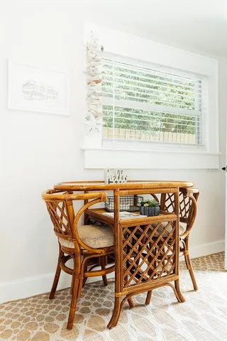 a view of a house with backyard sitting area and garden