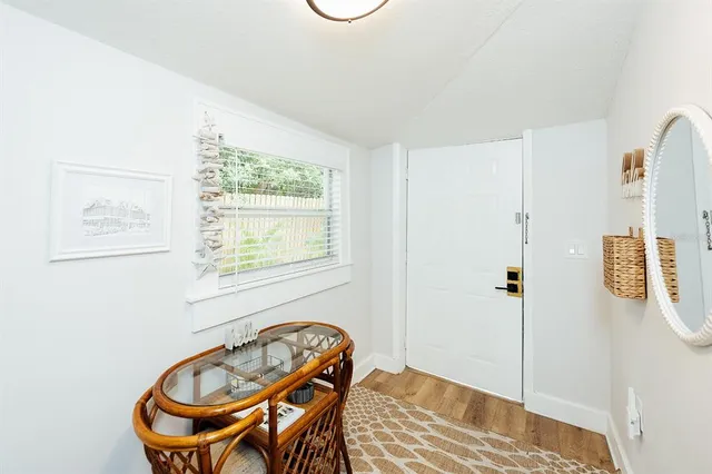 a view of yard with seating space and trees