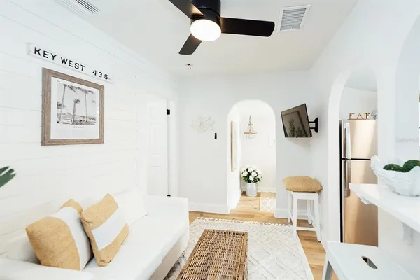 a kitchen with a sink a stove and cabinets