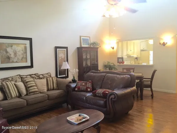 a view of a dining room with furniture and a window