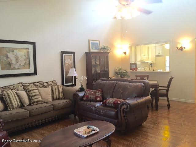 2016 Grant Place, Unit 9 Melbourne, FL 32901 - Photo 5 of 7 a living room with furniture and a large window