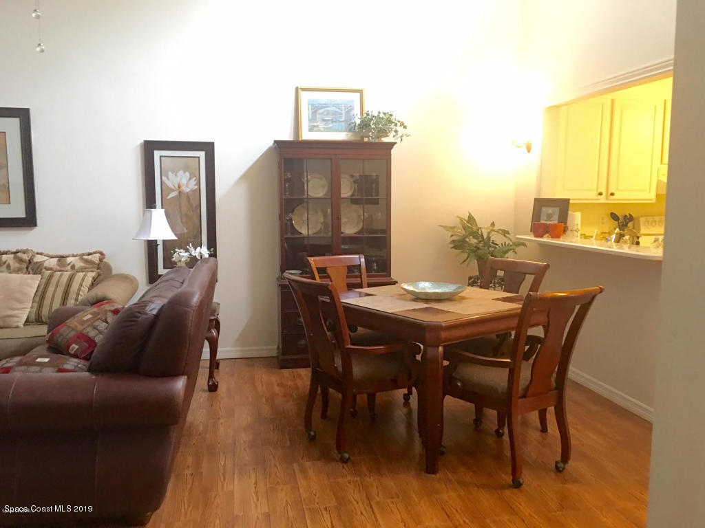 2016 Grant Place, Unit 9 Melbourne, FL 32901 - Photo 6 of 7 a view of a dining room with furniture and a window