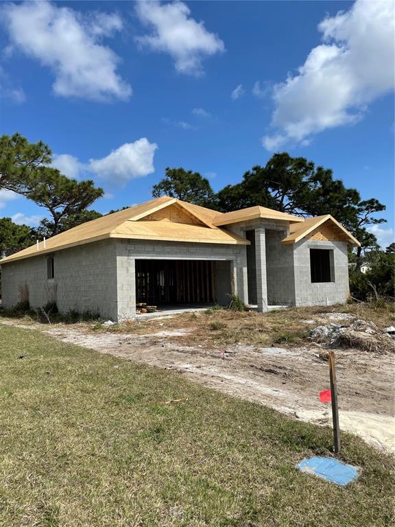 520 Sunset Road North Rotonda West, FL 33947 - Photo 1 of 1 a front view of a house with a yard