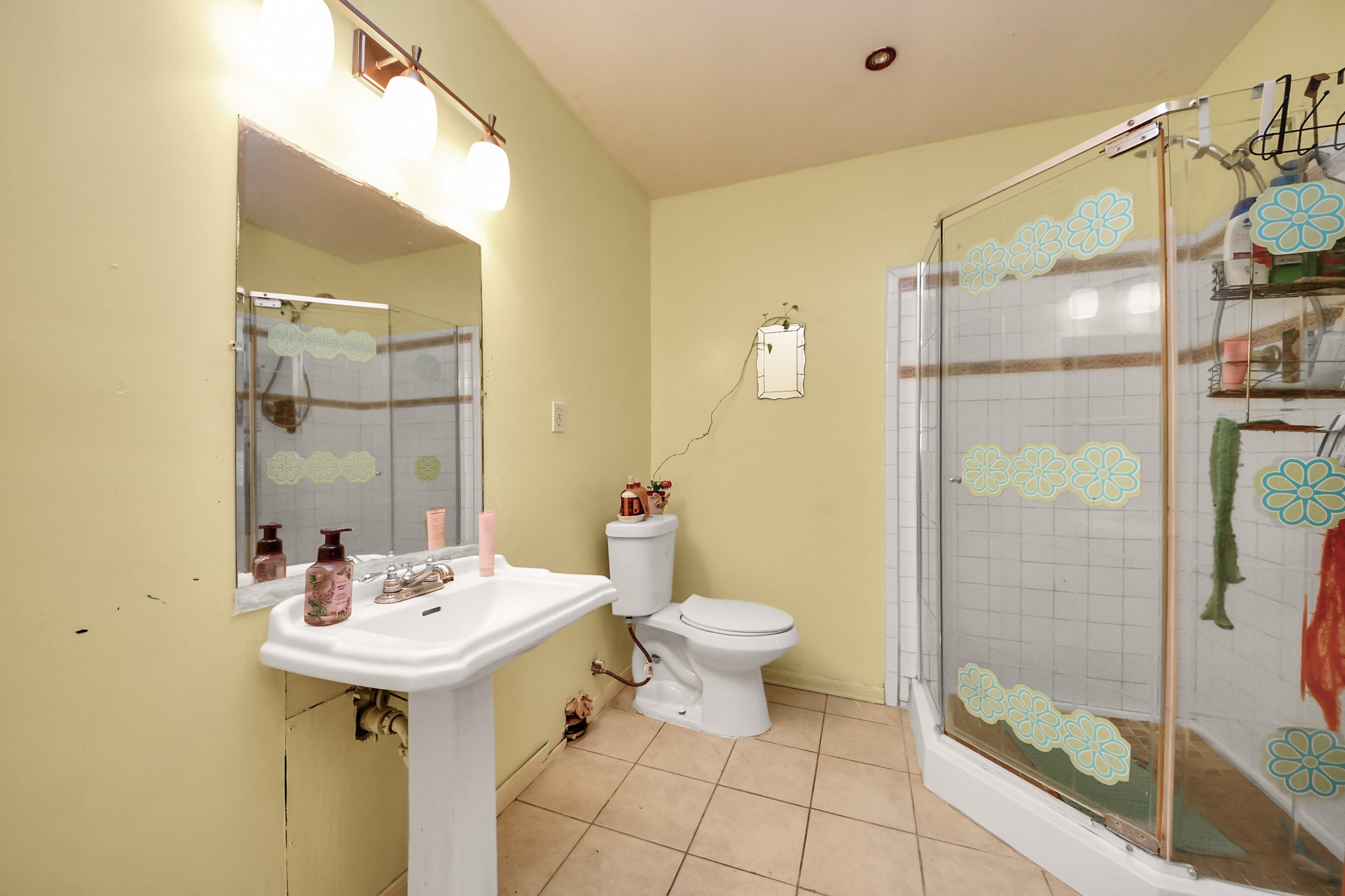 9701 Foredale Street Houston, TX 77075 - Photo 16 of 32 a bathroom with a sink toilet and shower