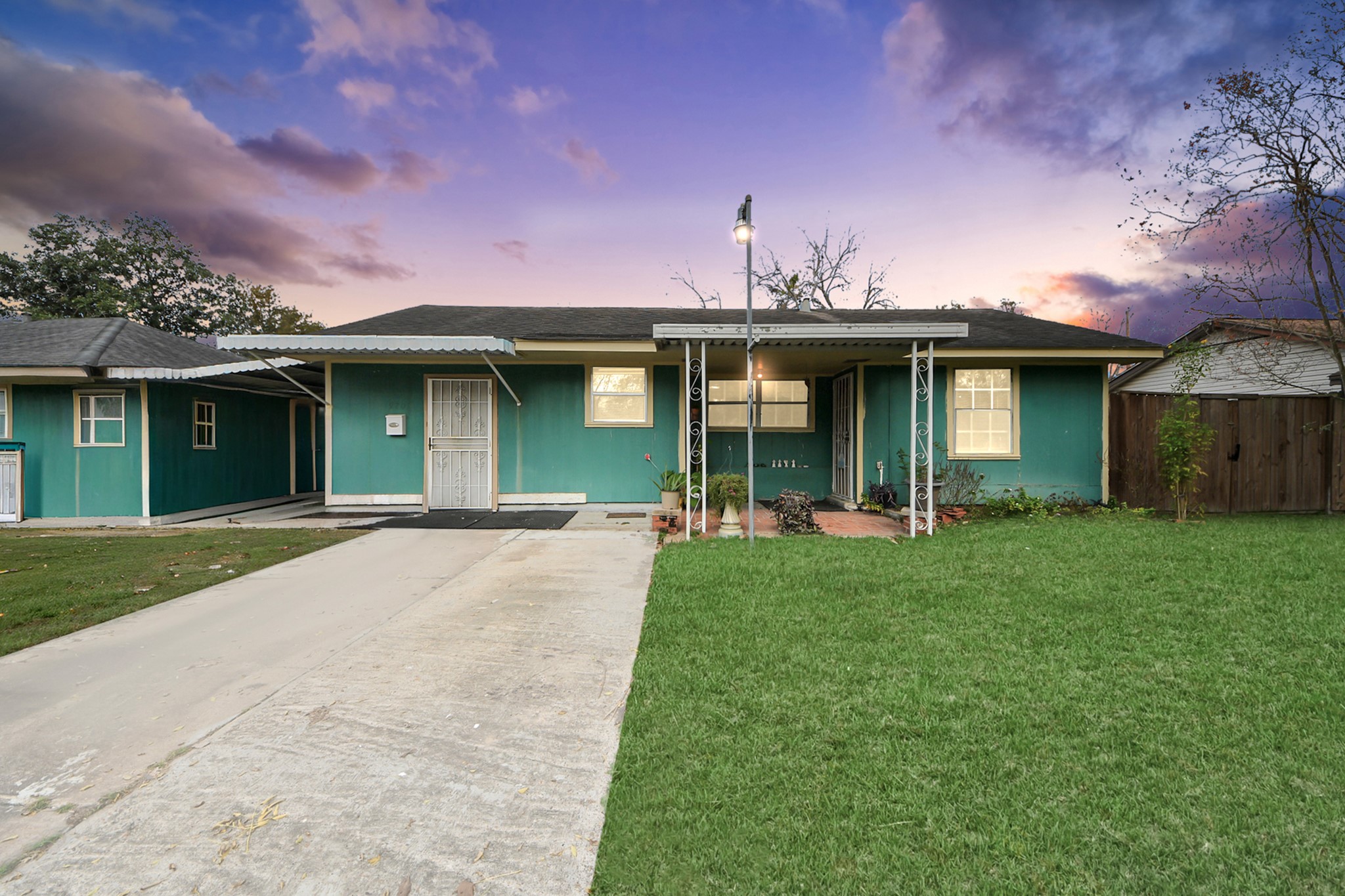 9701 Foredale Street Houston, TX 77075 - Photo 2 of 32 a front view of a house with a garden and yard