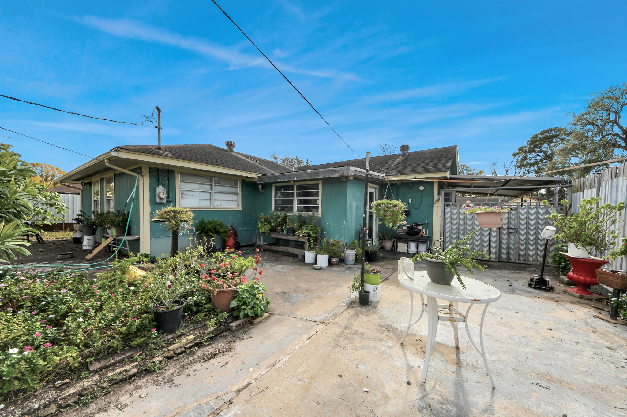 9701 Foredale Street Houston, TX 77075 - Photo 29 of 32 a front view of a house with a garden and porch