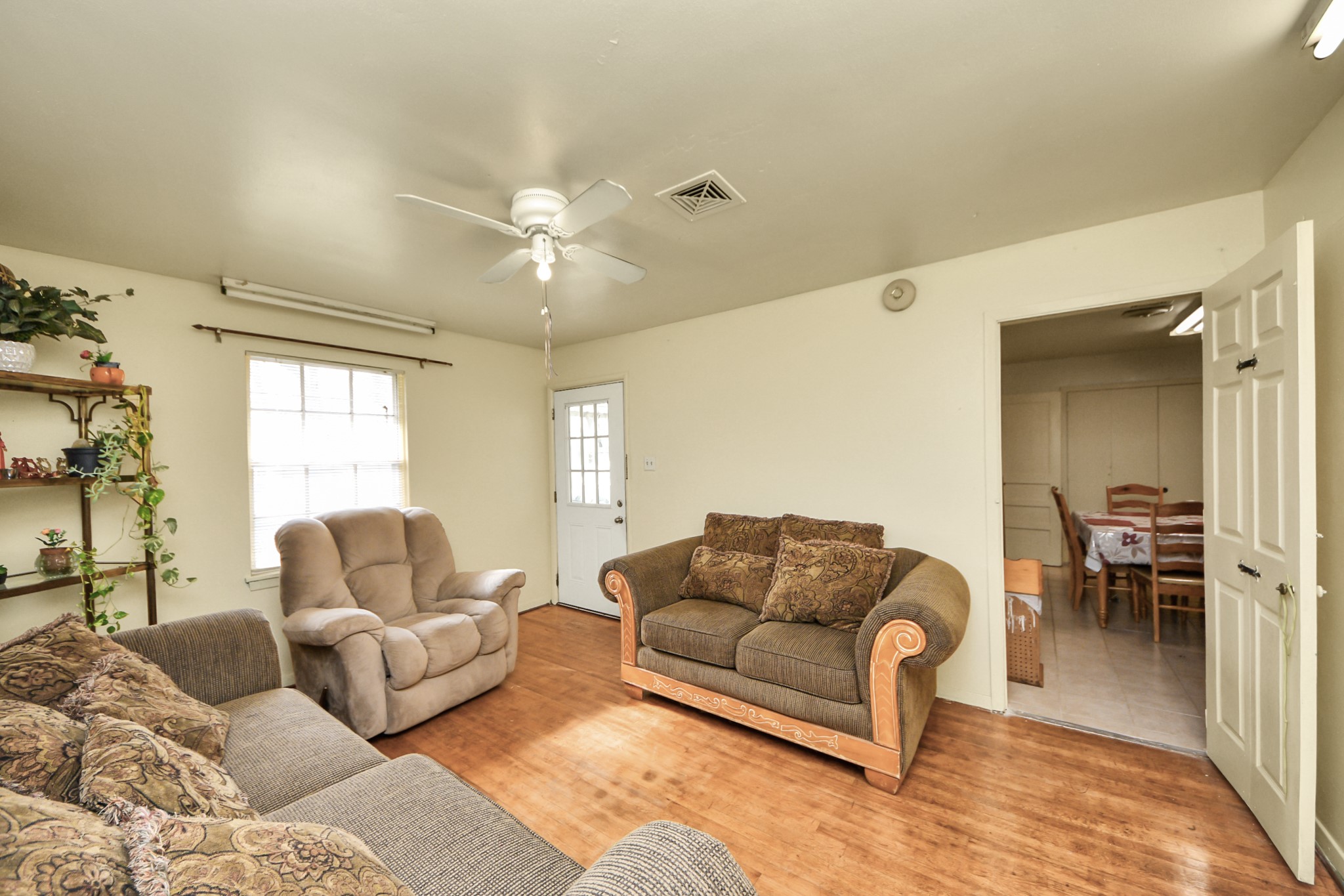 9701 Foredale Street Houston, TX 77075 - Photo 5 of 32 a living room with furniture ceiling fan and a window