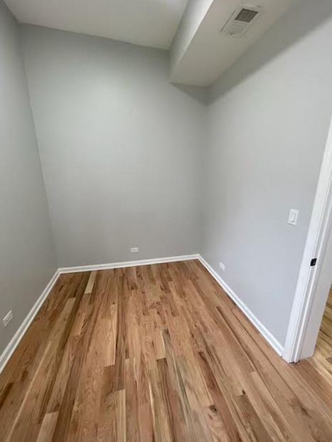 1227 South Springfield Avenue, Unit 1 Chicago, IL 60623 - Photo 4 of 6 a view of wooden floor