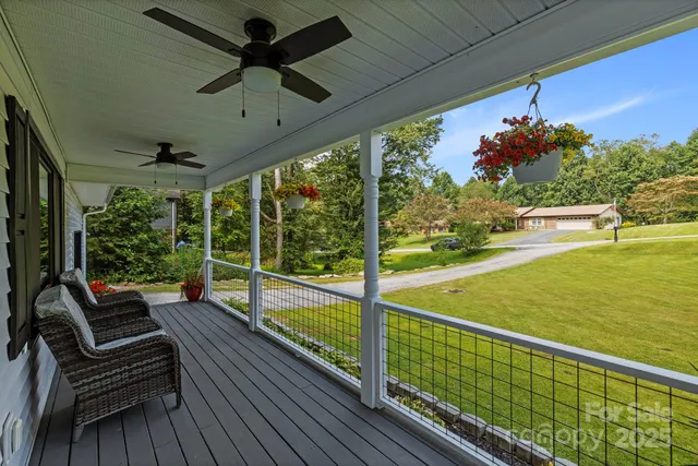 a view of a balcony with chairs