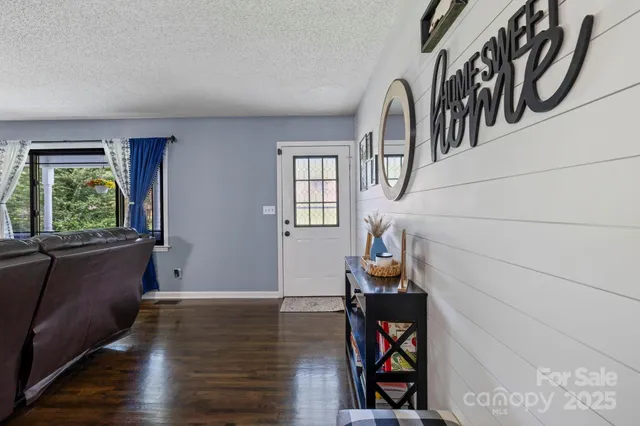a view of an entryway with wooden floor