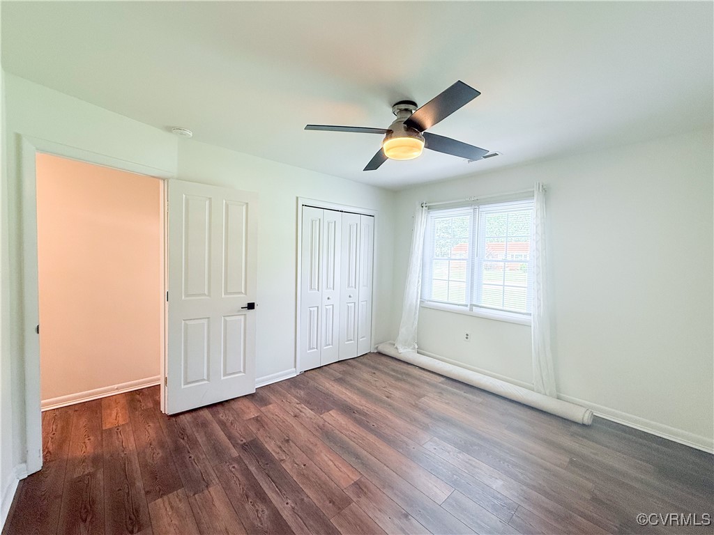 7908 Capistrano Drive Richmond, VA 23227 - Photo 12 of 22 a view of empty room with wooden floor and fan