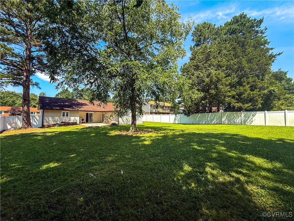 7908 Capistrano Drive Richmond, VA 23227 - Photo 16 of 22 a view of a house with a backyard