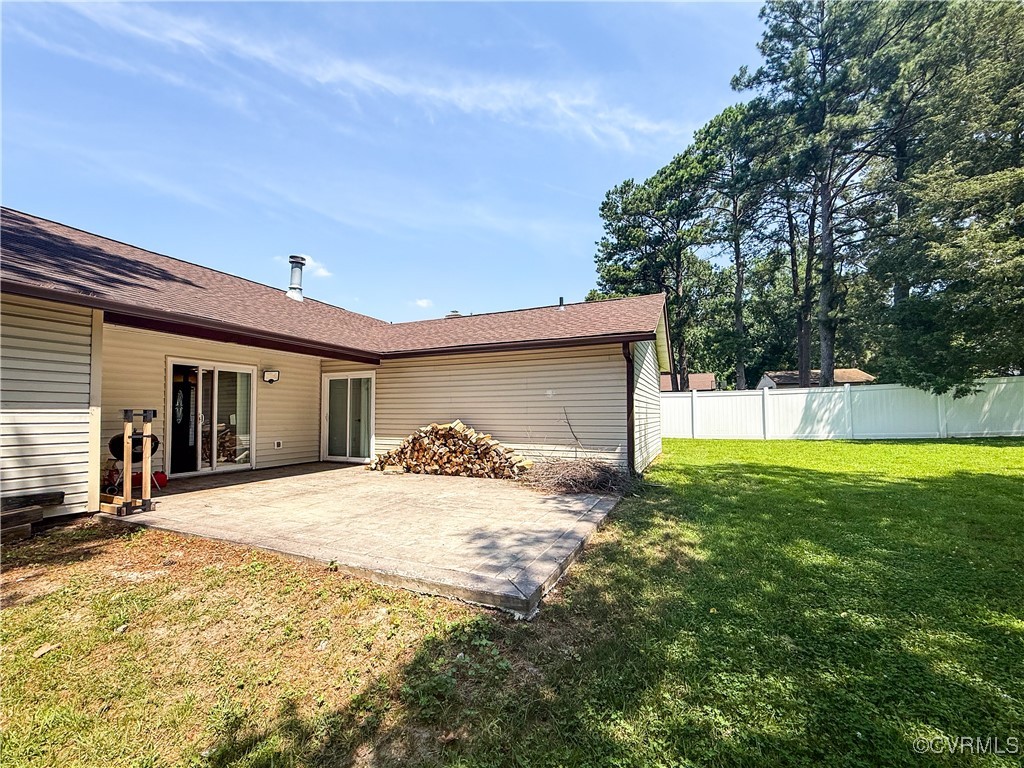 7908 Capistrano Drive Richmond, VA 23227 - Photo 19 of 22 a view of a house with a patio