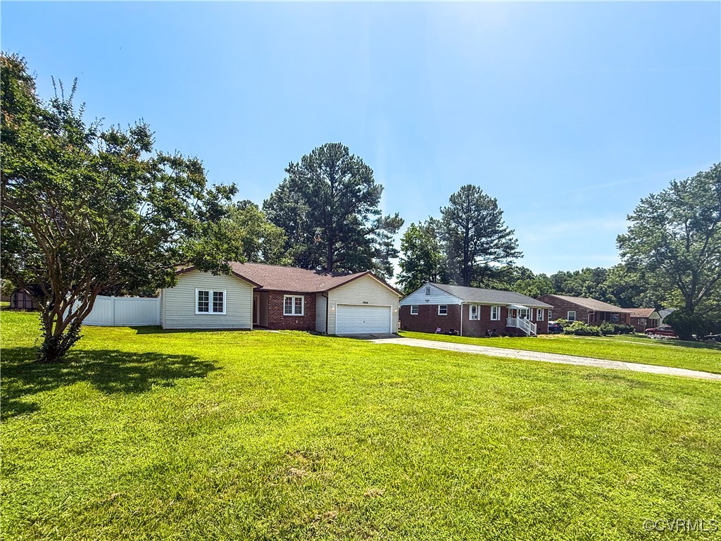 7908 Capistrano Drive Richmond, VA 23227 - Photo 22 of 22 a view of a house with swimming pool and yard