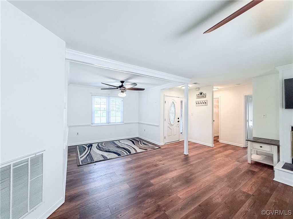 7908 Capistrano Drive Richmond, VA 23227 - Photo 3 of 22 an empty room with wooden floor and windows