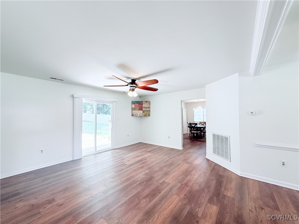 7908 Capistrano Drive Richmond, VA 23227 - Photo 4 of 22 wooden floor in an empty room with a window