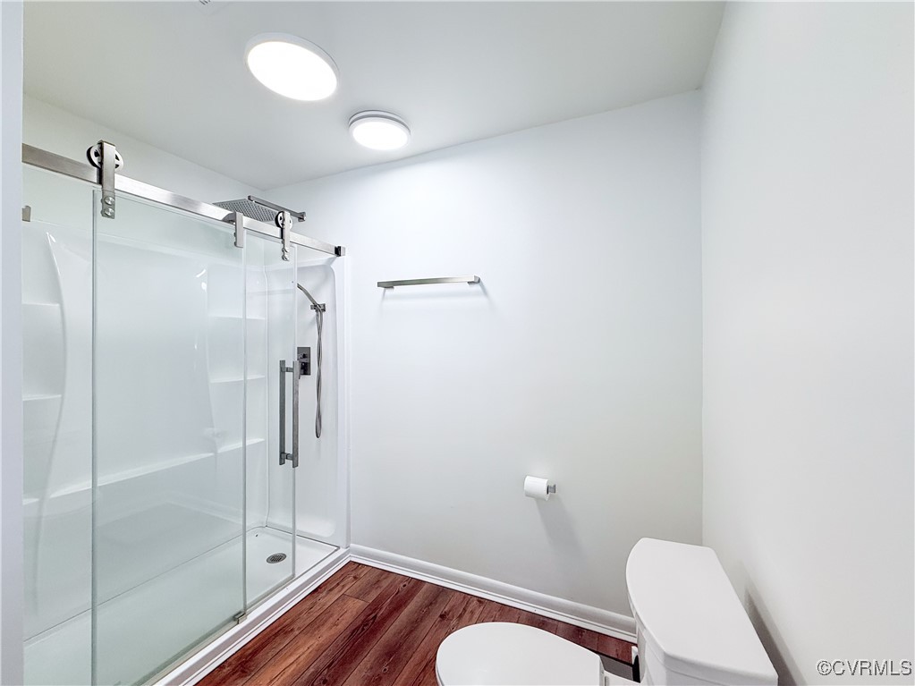 7908 Capistrano Drive Richmond, VA 23227 - Photo 10 of 22 a bathroom with a shower a toilet and sink