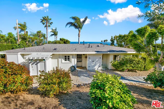 a view of a garden with a fountain
