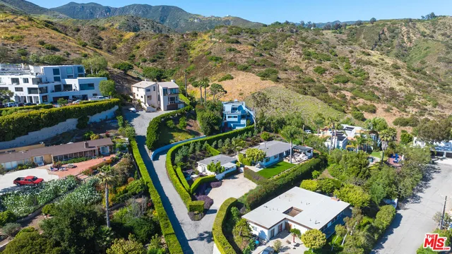 a view of a patio with couple of chairs