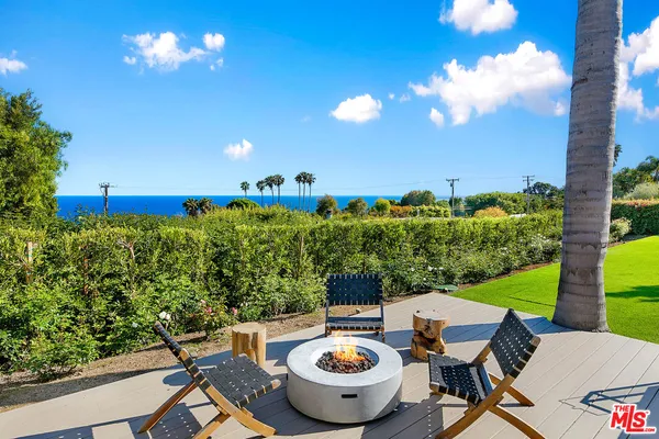 a view of a terrace with furniture and garden