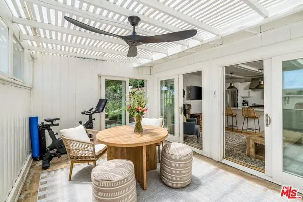 a kitchen with a sink a stove and cabinets