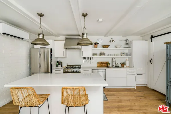 a bedroom with a bed and a view of bathroom