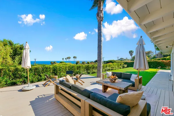 a view of swimming pool with a patio