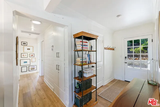 a view of a bedroom with furniture and closet