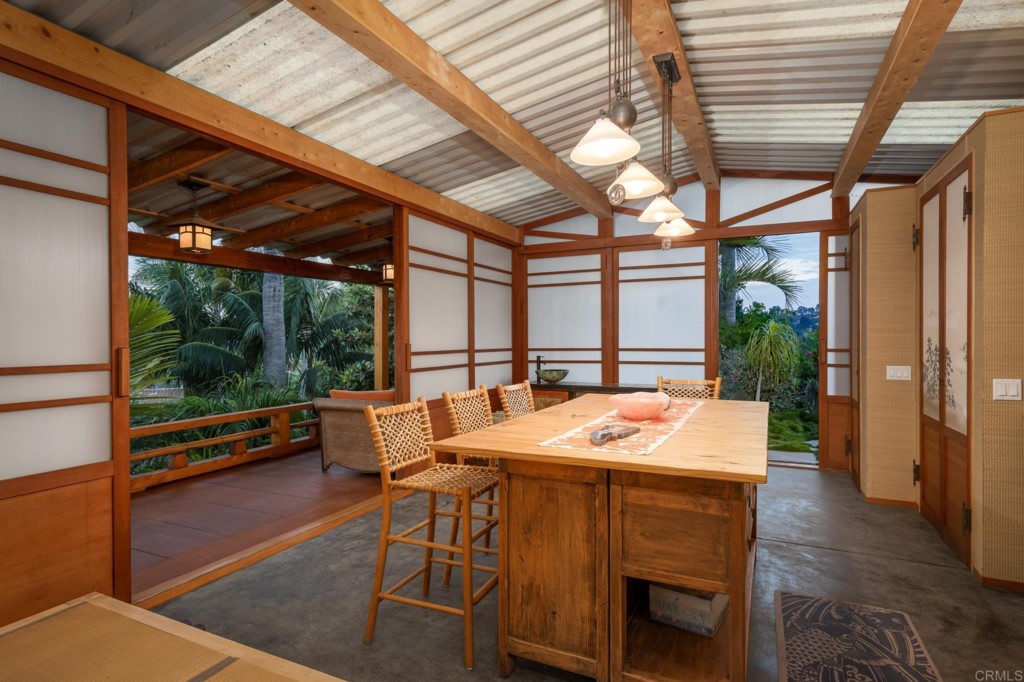 2892 Lone Jack Road Encinitas, CA 92024 - Photo 11 of 31 a dining room with a table and chairs