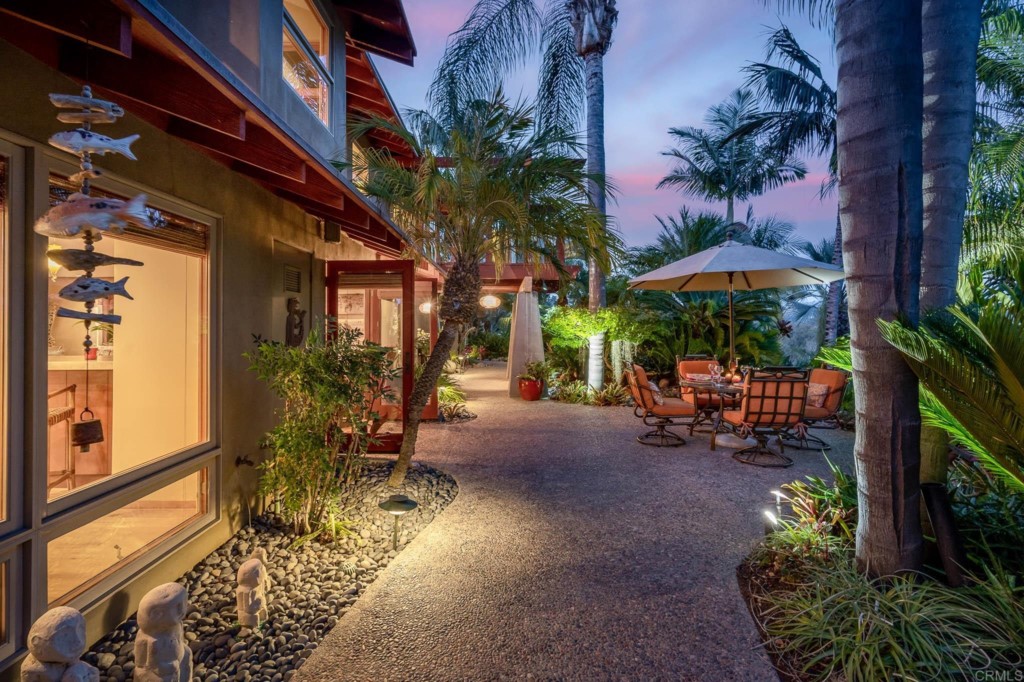 2892 Lone Jack Road Encinitas, CA 92024 - Photo 13 of 31 a view of a patio with a table and chairs under an umbrella