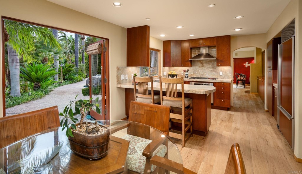 2892 Lone Jack Road Encinitas, CA 92024 - Photo 17 of 31 a view of a dining room with furniture window and wooden floor