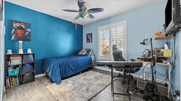 a bedroom with furniture and a window