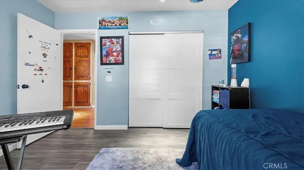 a bedroom with a bed and a couch