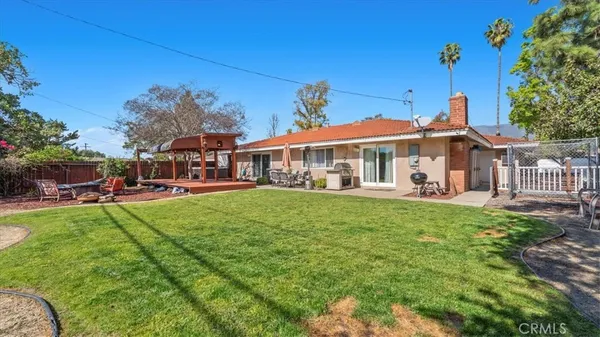 a view of a house with a yard porch and sitting area